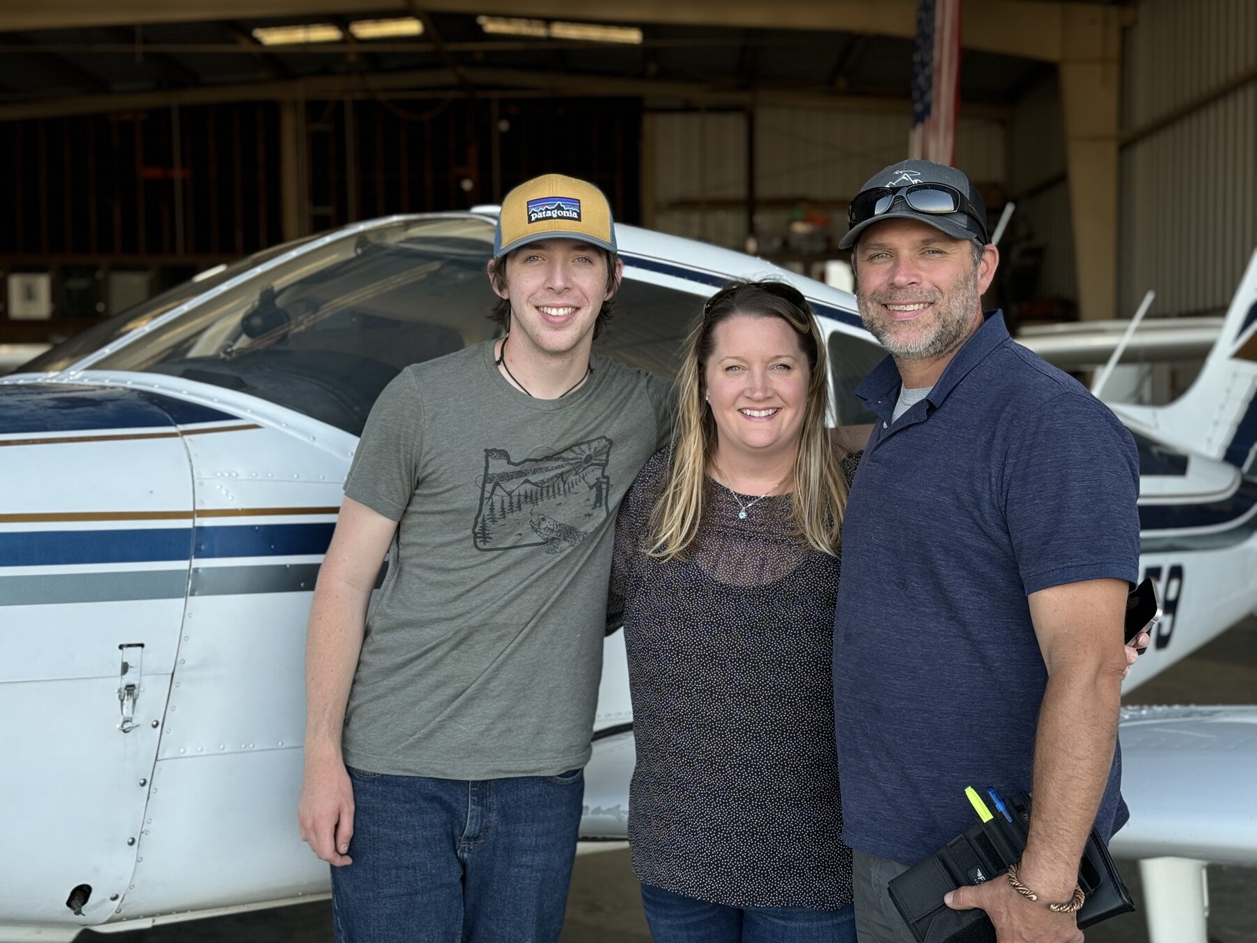 A family with a North Aero training aircraft on the Salinas ramp