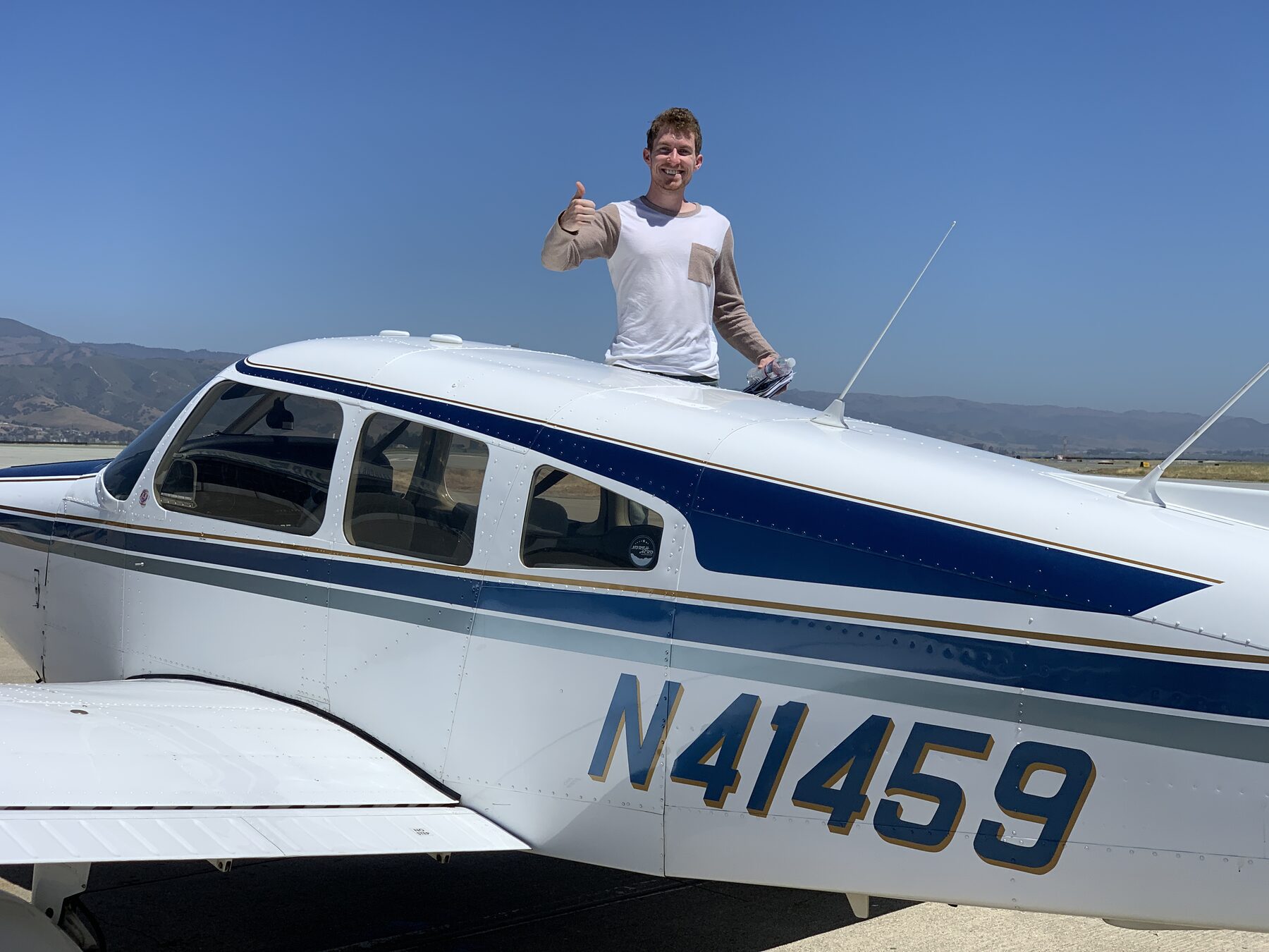 Student celebrating on the wing of N41459 after solo