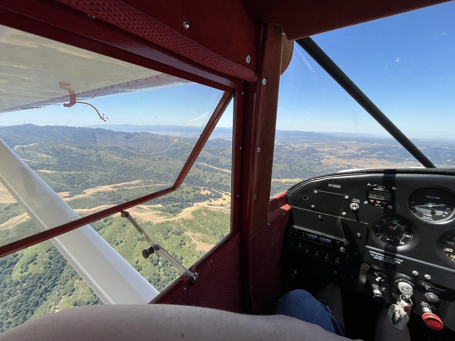 In-flight view over the hills from a tailwheel airplane