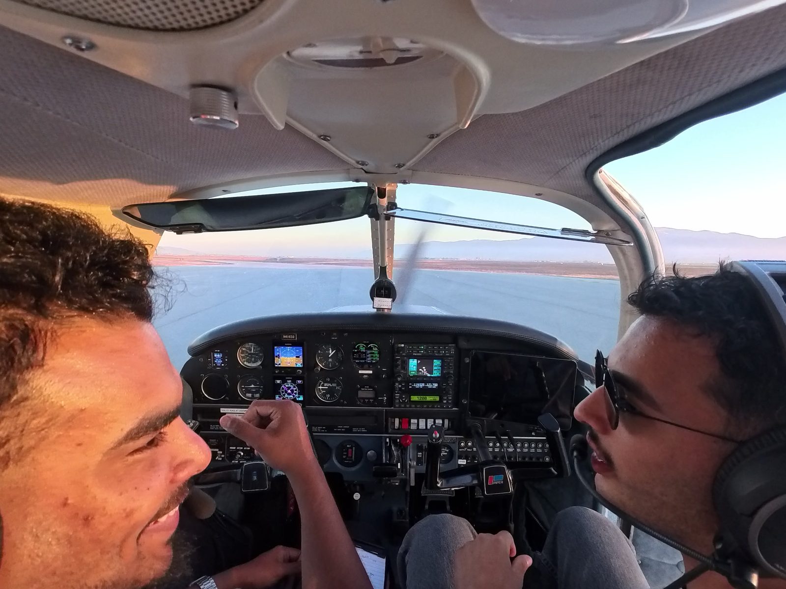 Nazeem and his instructor Gabriel Barajas bump fists in the Warrior's cockpit before Gabe gets out.