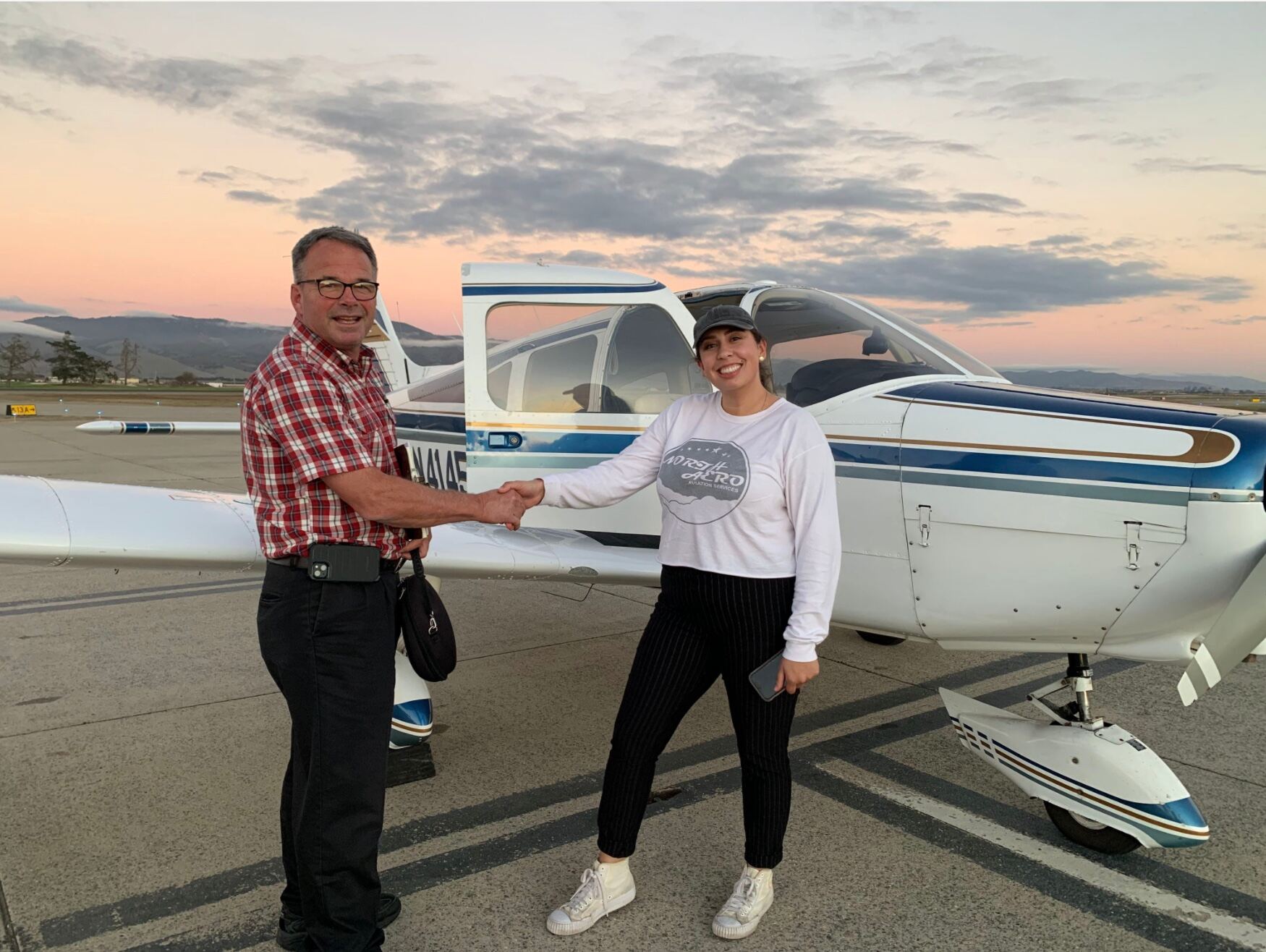 A North Aero student celebrating a checkride pass